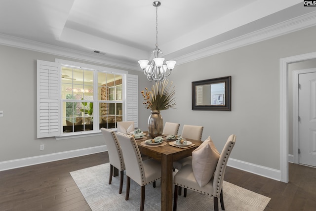 143 Club Ridge Rd, Elgin, SC 29045 - dining room with a chandelier, dark wood finished floors, a raised ceiling, and crown molding