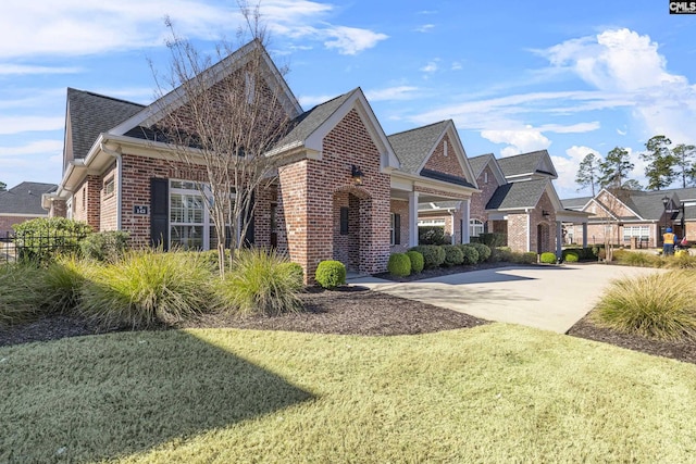 143 Club Ridge Rd, Elgin, SC 29045 - view of front facade featuring brick siding and roof with shingles