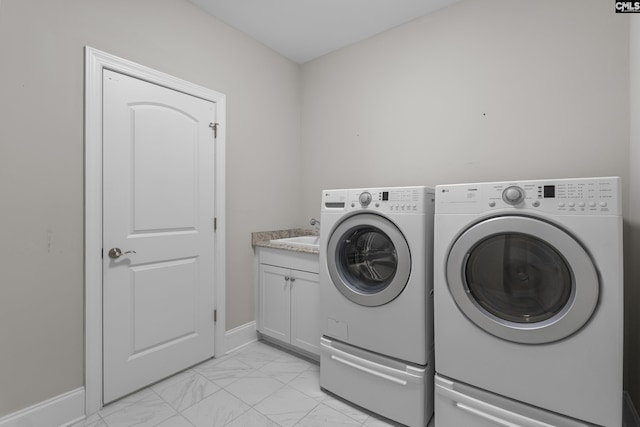 143 Club Ridge Rd, Elgin, SC 29045 - laundry room featuring washer and dryer, light marble finish floors, and cabinet space