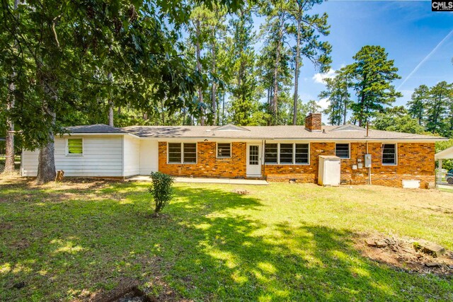 1748 Omarest Dr, Columbia, SC 29210 - back of house featuring a chimney, a lawn, brick siding, and crawl space