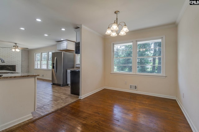 1748 Omarest Dr, Columbia, SC 29210 - kitchen featuring stainless steel fridge with ice dispenser, crown molding, hardwood / wood-style flooring, ceiling fan, and a chandelier