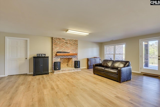 518 Pioneer Shores Rd, Prosperity, SC 29127 - living room with light wood finished floors and a brick fireplace
