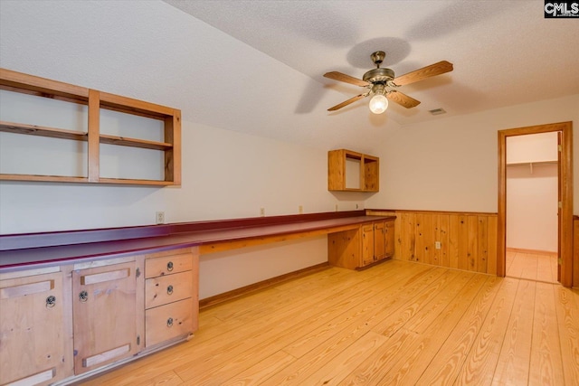 518 Pioneer Shores Rd, Prosperity, SC 29127 - kitchen featuring built in desk, lofted ceiling, light wood-style floors, ceiling fan, and wainscoting