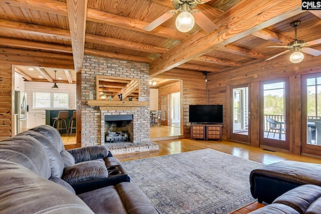 518 Pioneer Shores Rd, Prosperity, SC 29127 - living room featuring a ceiling fan, a wood ceiling with exposed beams, hardwood / wood-style flooring, and a brick fireplace