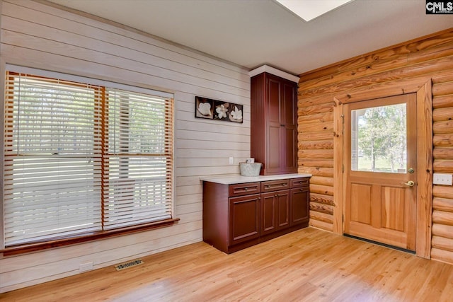 518 Pioneer Shores Rd, Prosperity, SC 29127 - foyer with healthy amount of natural light, light wood finished floors, and log walls