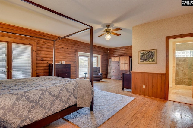 518 Pioneer Shores Rd, Prosperity, SC 29127 - bedroom featuring wood finished floors, wooden walls, a wainscoted wall, and ceiling fan