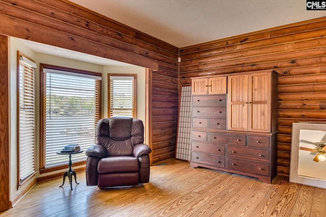 518 Pioneer Shores Rd, Prosperity, SC 29127 - living area with light wood finished floors and rustic walls