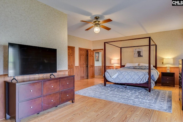518 Pioneer Shores Rd, Prosperity, SC 29127 - bedroom with wainscoting, light wood-style flooring, and a ceiling fan