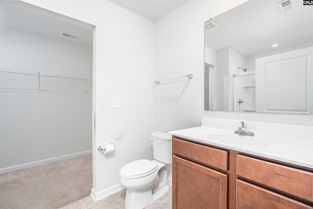 939 Sequoia Dr, Lexington, SC 29073 - bathroom featuring vanity, a spacious closet, a shower, and tile patterned floors
