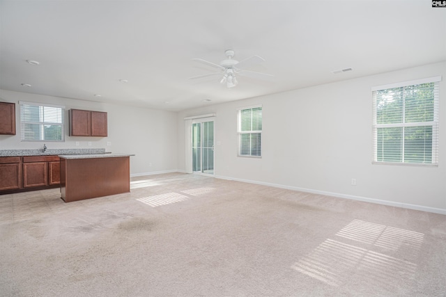 939 Sequoia Dr, Lexington, SC 29073 - unfurnished living room featuring light carpet and ceiling fan