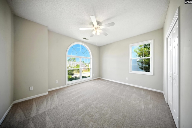 216 Founders Ridge Rd, Columbia, SC 29229 - unfurnished bedroom with carpet, a textured ceiling, a closet, and a ceiling fan