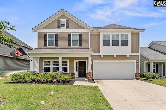 823 Queenshire Ln, Elgin, SC 29045 - craftsman inspired home featuring a front lawn, concrete driveway, a garage, and stone siding