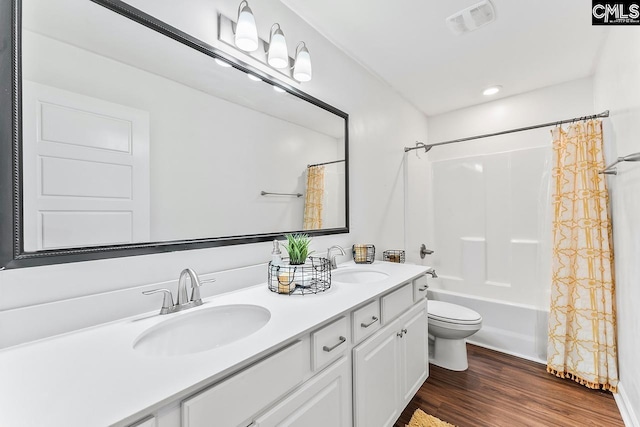 823 Queenshire Ln, Elgin, SC 29045 - bathroom featuring double vanity, wood finished floors, shower / bath combination with curtain, and recessed lighting