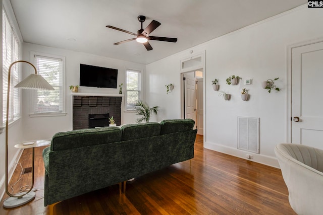 335-337 S Woodrow St, Columbia, SC 29205 - living room featuring wood finished floors, a fireplace, and ceiling fan