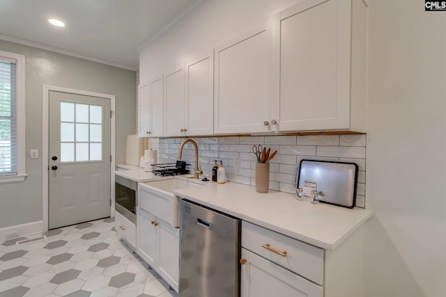 335-337 S Woodrow St, Columbia, SC 29205 - kitchen featuring dishwasher, ornamental molding, light countertops, tasteful backsplash, and white cabinetry