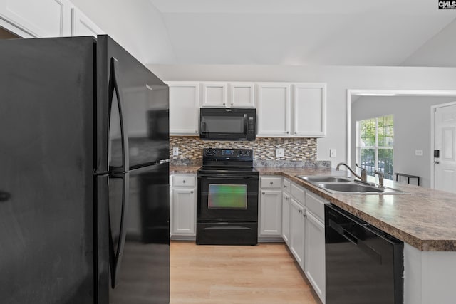 3 Fonthill Ct, Columbia, SC 29229 - kitchen featuring black appliances, a peninsula, light wood-type flooring, white cabinets, and decorative backsplash
