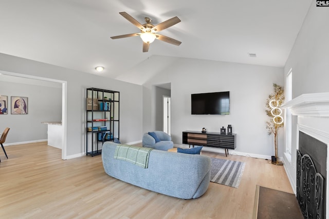 3 Fonthill Ct, Columbia, SC 29229 - living area featuring light wood-style floors, a ceiling fan, vaulted ceiling, and a fireplace with flush hearth