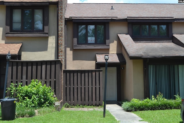 169 Lionsgate Rd, Columbia, SC 29223 - doorway to property featuring stucco siding and roof with shingles