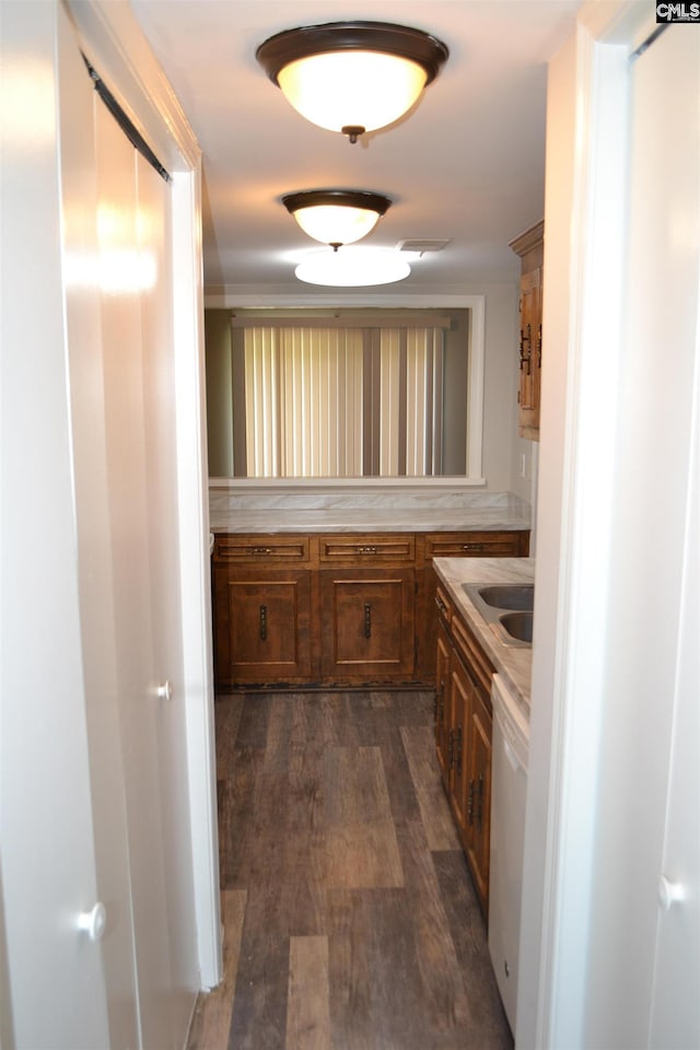 169 Lionsgate Rd, Columbia, SC 29223 - kitchen with dishwasher, brown cabinets, light countertops, and dark wood-type flooring