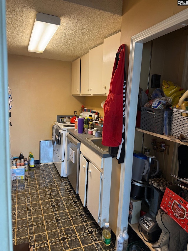 1520 Senate St Unit 197, Columbia, SC 29201 - washroom featuring dark flooring, separate washer and dryer, and a textured ceiling