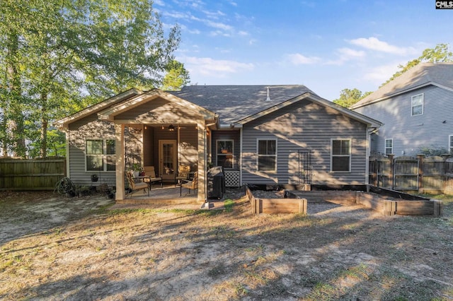 6 Genessee Ct, Irmo, SC 29063 - back of house with a vegetable garden, a patio area, and a fenced backyard