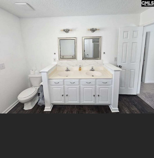 11 Long Glen Ct, Columbia, SC 29229 - full bathroom with wood finished floors, double vanity, and a textured ceiling