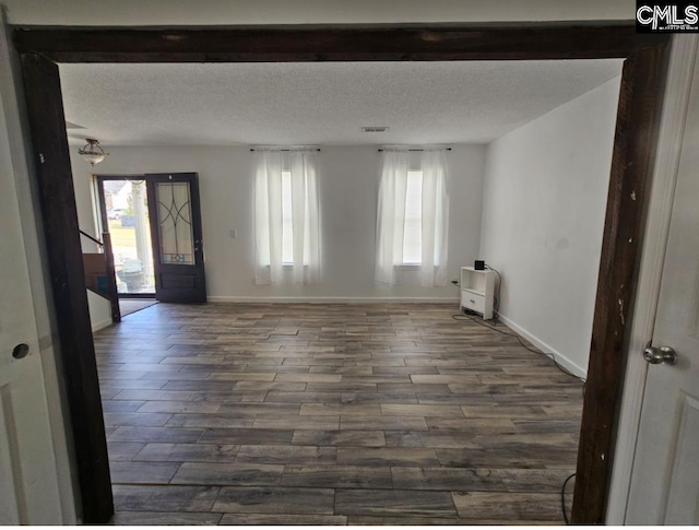 11 Long Glen Ct, Columbia, SC 29229 - empty room with dark wood-style floors, plenty of natural light, and a textured ceiling