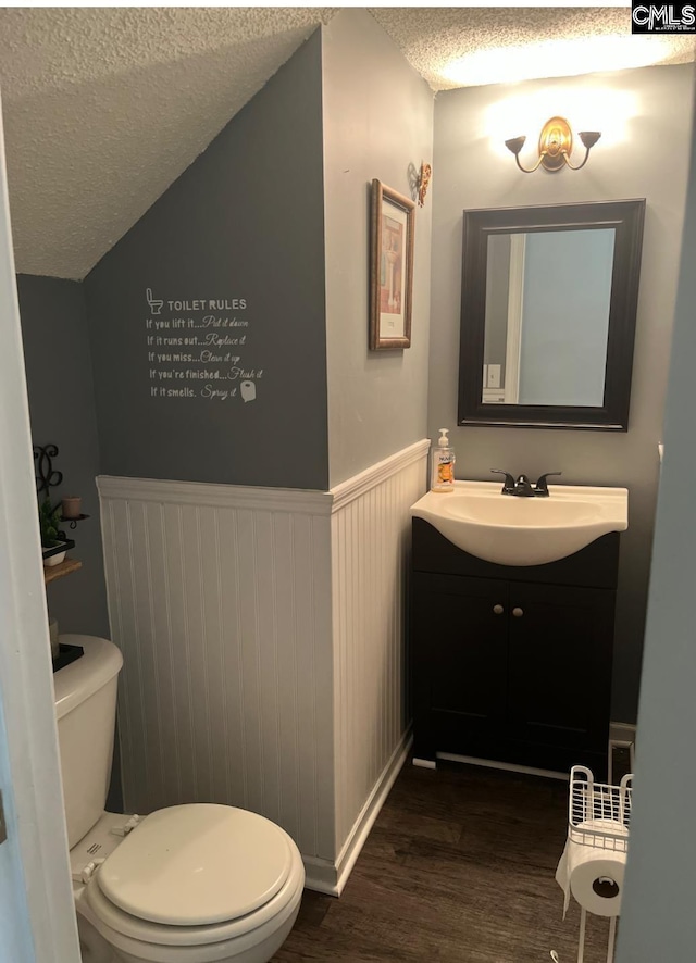 11 Long Glen Ct, Columbia, SC 29229 - half bath with a textured ceiling, wood finished floors, vanity, and a wainscoted wall