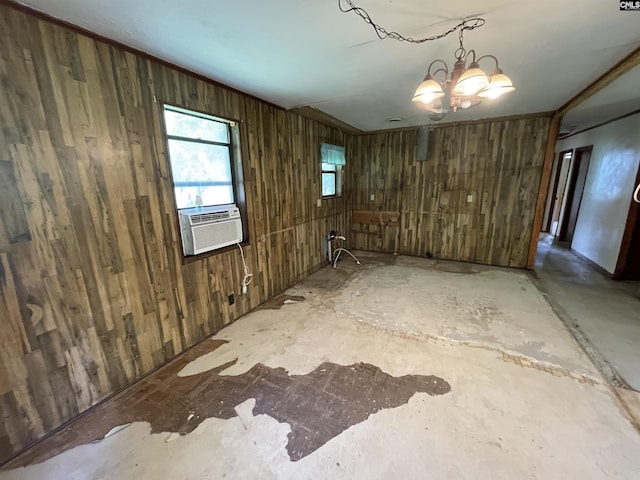 110 Quattlebaum Ave, Ridge Spring, SC 29129 - spare room featuring wood walls, cooling unit, and a chandelier