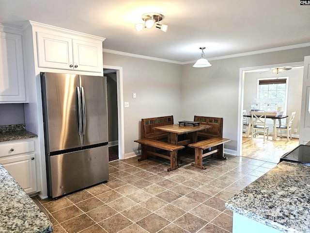 904 Sunnyhill Dr, Camden, SC 29020 - tiled dining space featuring crown molding and ceiling fan