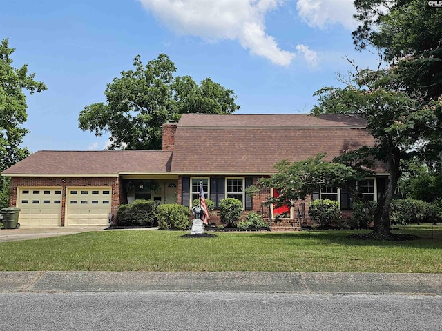 904 Sunnyhill Dr, Camden, SC 29020 - colonial inspired home with an attached garage, brick siding, a front lawn, concrete driveway, and roof with shingles