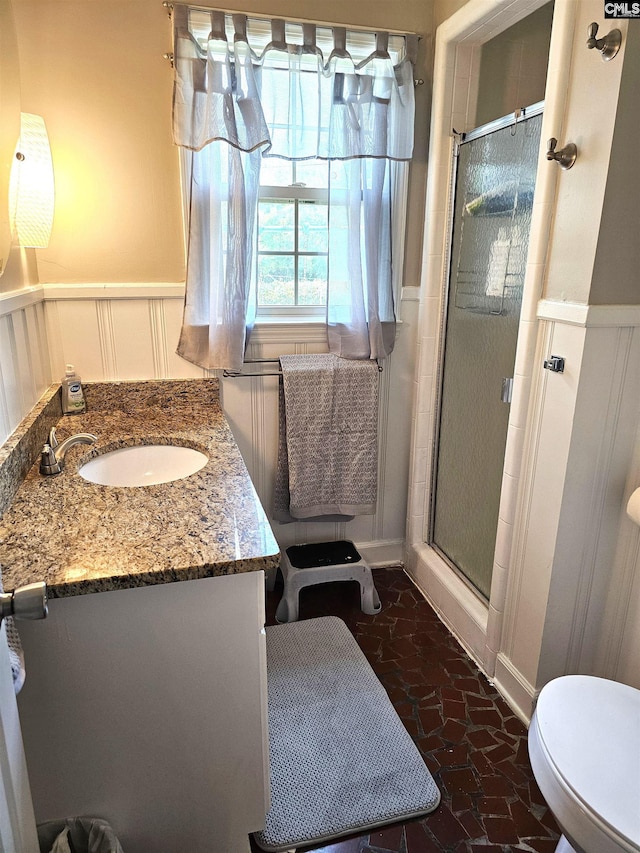 904 Sunnyhill Dr, Camden, SC 29020 - bathroom with a shower stall, a wainscoted wall, vanity, and a decorative wall