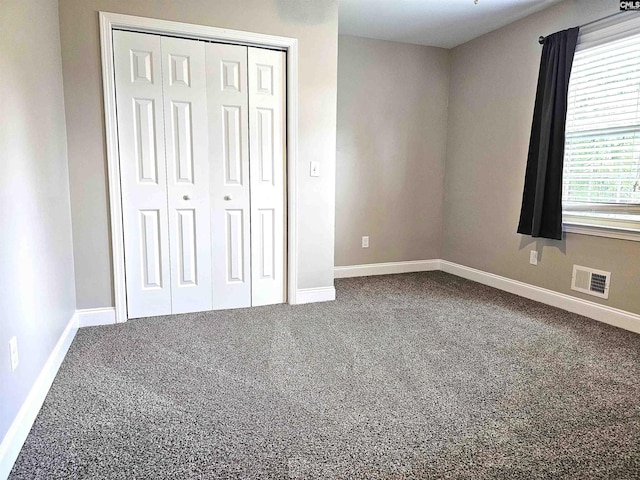 904 Sunnyhill Dr, Camden, SC 29020 - unfurnished bedroom featuring carpet flooring and a closet