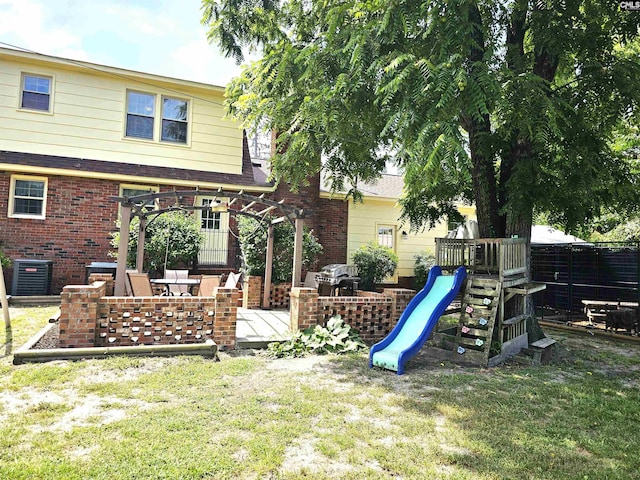 904 Sunnyhill Dr, Camden, SC 29020 - back of house featuring brick siding and a pergola