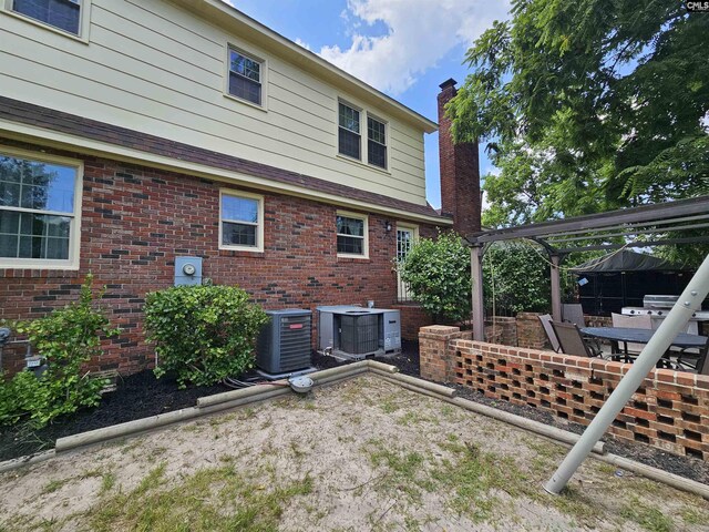 904 Sunnyhill Dr, Camden, SC 29020 - rear view of property featuring a chimney and brick siding