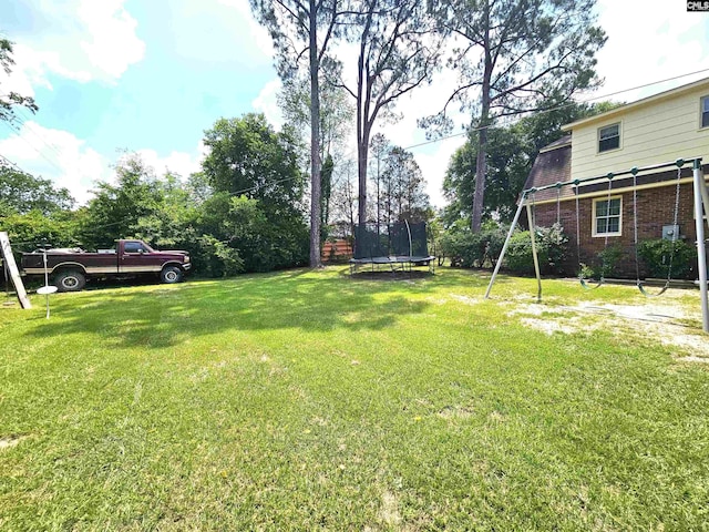 904 Sunnyhill Dr, Camden, SC 29020 - view of grassy yard featuring a trampoline