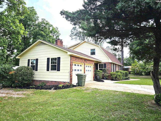 904 Sunnyhill Dr, Camden, SC 29020 - view of front facade featuring a garage, concrete driveway, a chimney, a front yard, and brick siding
