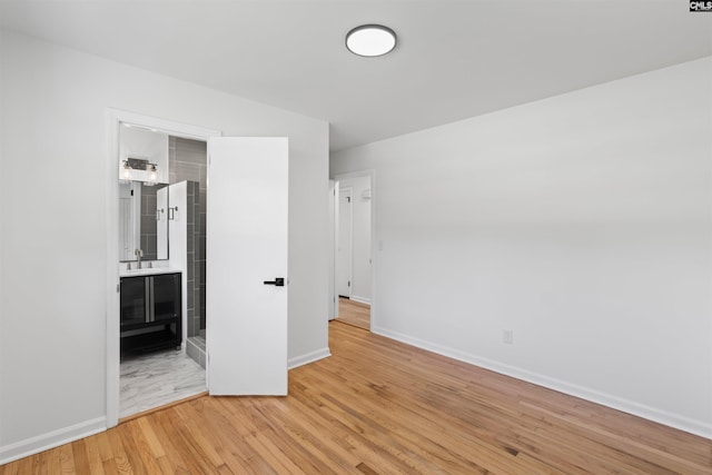 2109 Sheffield Ln, Cayce, SC 29033 - unfurnished bedroom featuring a sink and light wood-type flooring