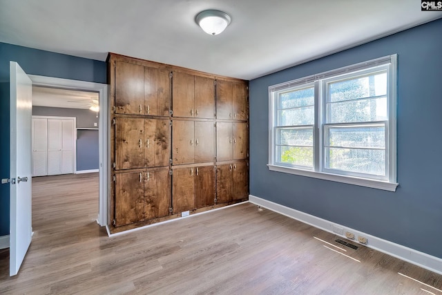 914 Hook Ave, West Columbia, SC 29169 - unfurnished bedroom with light wood-type flooring and a closet