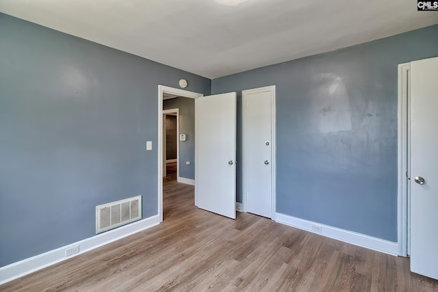 914 Hook Ave, West Columbia, SC 29169 - unfurnished bedroom with wood finished floors and a closet