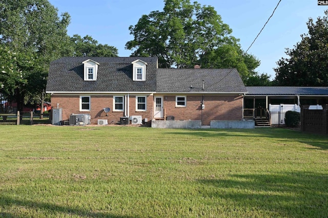 214 Mac St, Leesville, SC 29070 - back of property with entry steps, brick siding, and a lawn