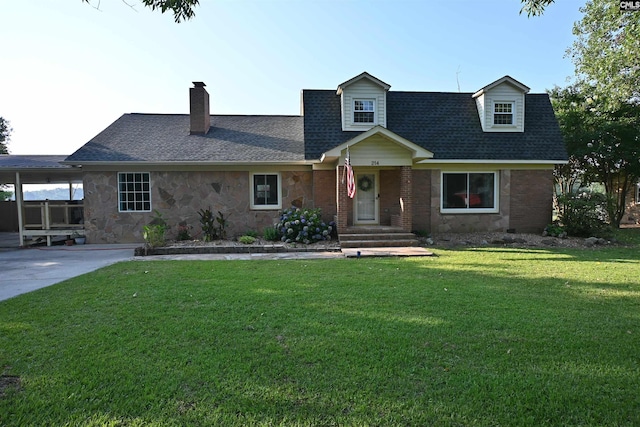 214 Mac St, Leesville, SC 29070 - view of front of house with a front lawn, a chimney, stone siding, and roof with shingles