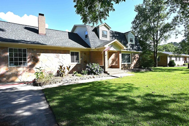 214 Mac St, Leesville, SC 29070 - cape cod-style house with stone siding, a front lawn, a shingled roof, and a chimney