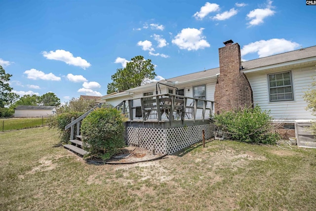 122 Partridge Hill Dr, West Columbia, SC 29172 - back of property featuring a chimney and a wooden deck