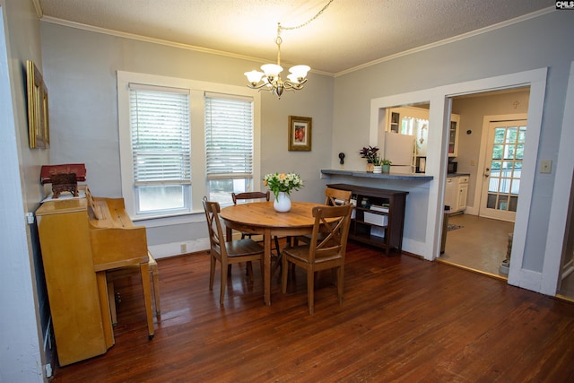 616 Mcrae Rd, Camden, SC 29020 - dining space with a chandelier, ornamental molding, wood finished floors, and a textured ceiling