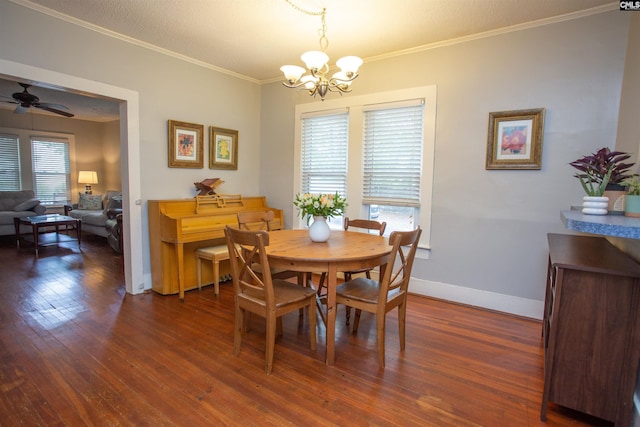 616 Mcrae Rd, Camden, SC 29020 - dining area with a chandelier, dark wood finished floors, crown molding, and ceiling fan