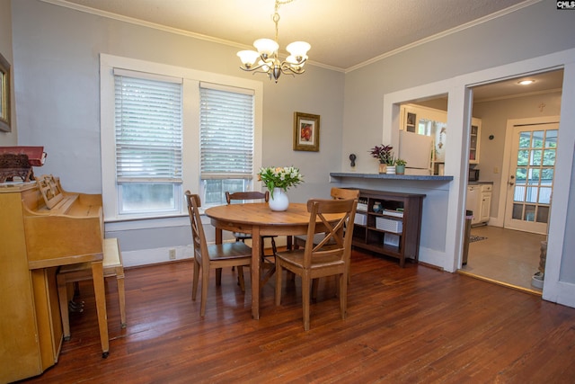 616 Mcrae Rd, Camden, SC 29020 - dining space with a chandelier, ornamental molding, and wood finished floors