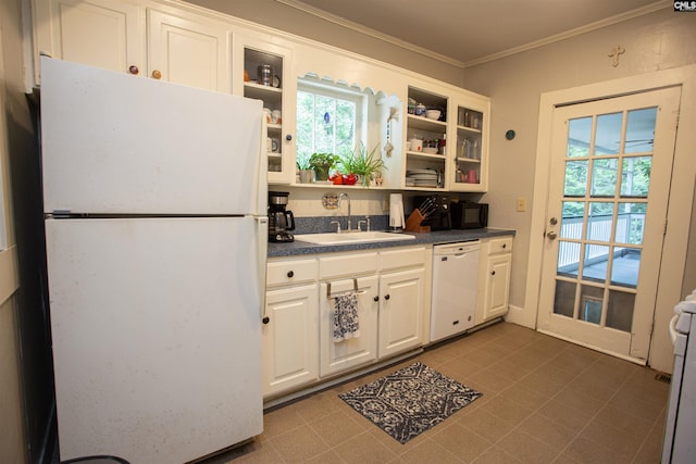 616 Mcrae Rd, Camden, SC 29020 - kitchen featuring white appliances, plenty of natural light, dark countertops, ornamental molding, and glass insert cabinets