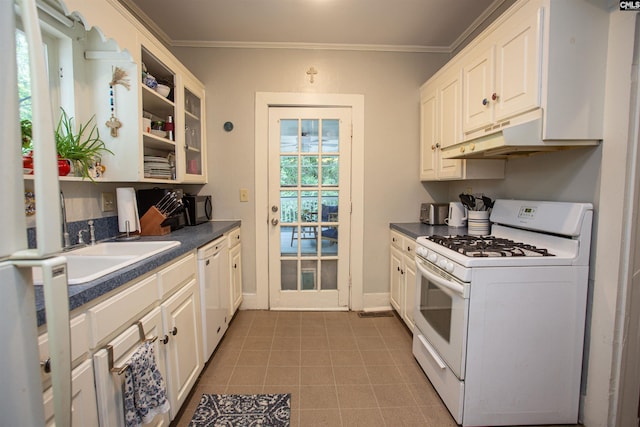 616 Mcrae Rd, Camden, SC 29020 - kitchen featuring white appliances, dark countertops, ornamental molding, under cabinet range hood, and white cabinetry