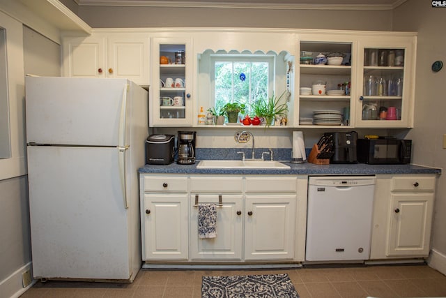 616 Mcrae Rd, Camden, SC 29020 - kitchen with white appliances, white cabinets, dark countertops, glass insert cabinets, and tile patterned flooring